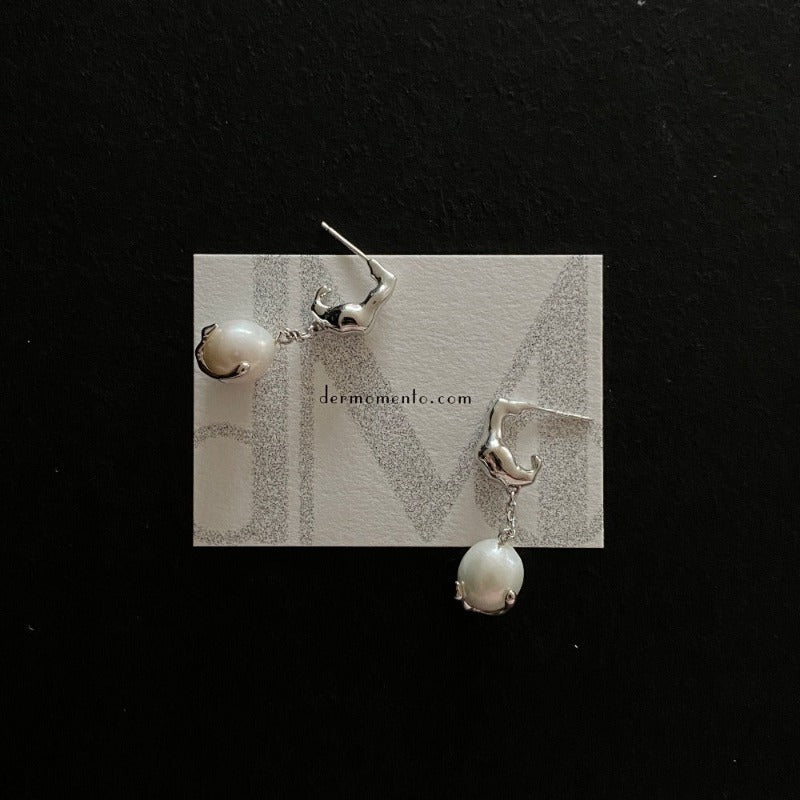 Baroque pearl drop earrings with claw form in sterling silver crafted with a white rhodium-plated finish.