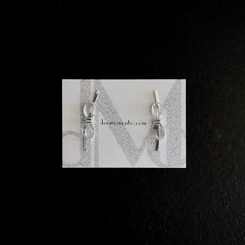 Amelia Ribbon Stud Earrings | dermomento.com – Bow-tie shaped stud earrings crafted from sterling silver flat snake chain material.
