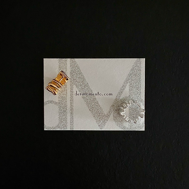 Two Foil Pleat Hoop Earrings in 18k gold and silver color.