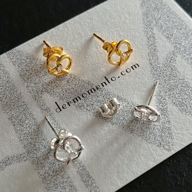 Made of sterling silver with a Pretzel shape 🥨 and adorned with dazzling cubic zirconia, subtle yet striking. Designed for everyday wear and special occasions alike.