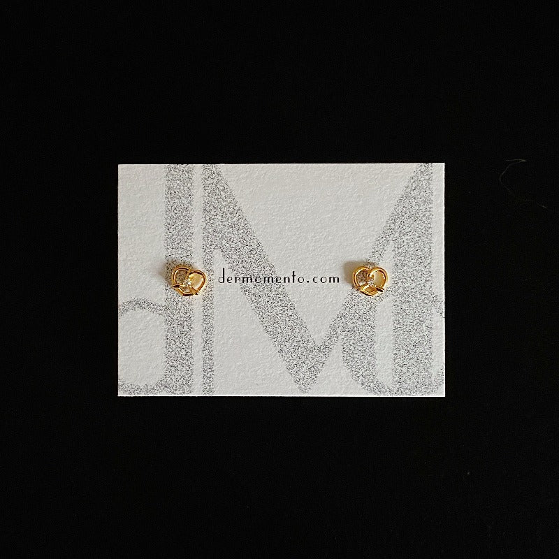 Made of sterling silver with a Pretzel shape 🥨 and adorned with dazzling cubic zirconia, subtle yet striking. Designed for everyday wear and special occasions alike.