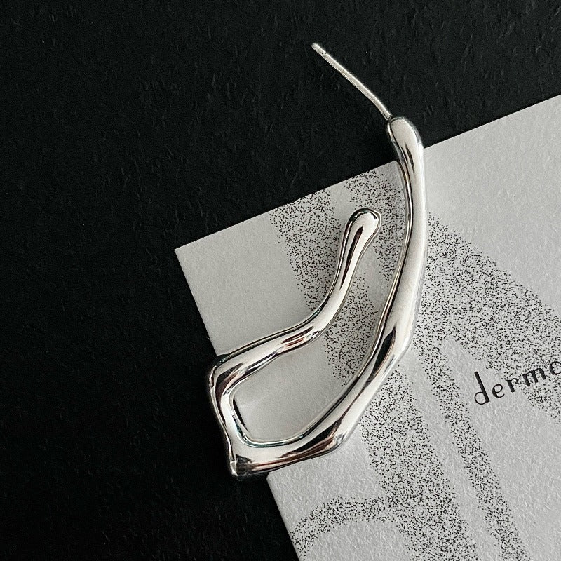 Squiggle-form earrings crafted in sterling silver, designed for a statement-making look that stands out.