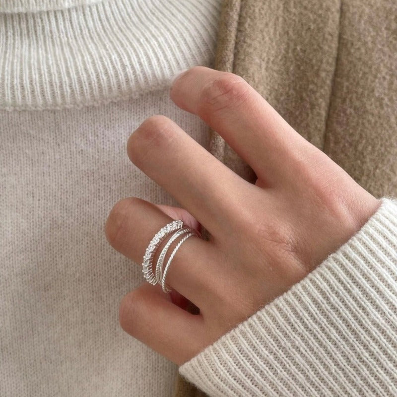 Composted of three different textured fine rings (3-in-1) A perfect versatile piece crafted in sterling silver for wearing alone or stacking together.