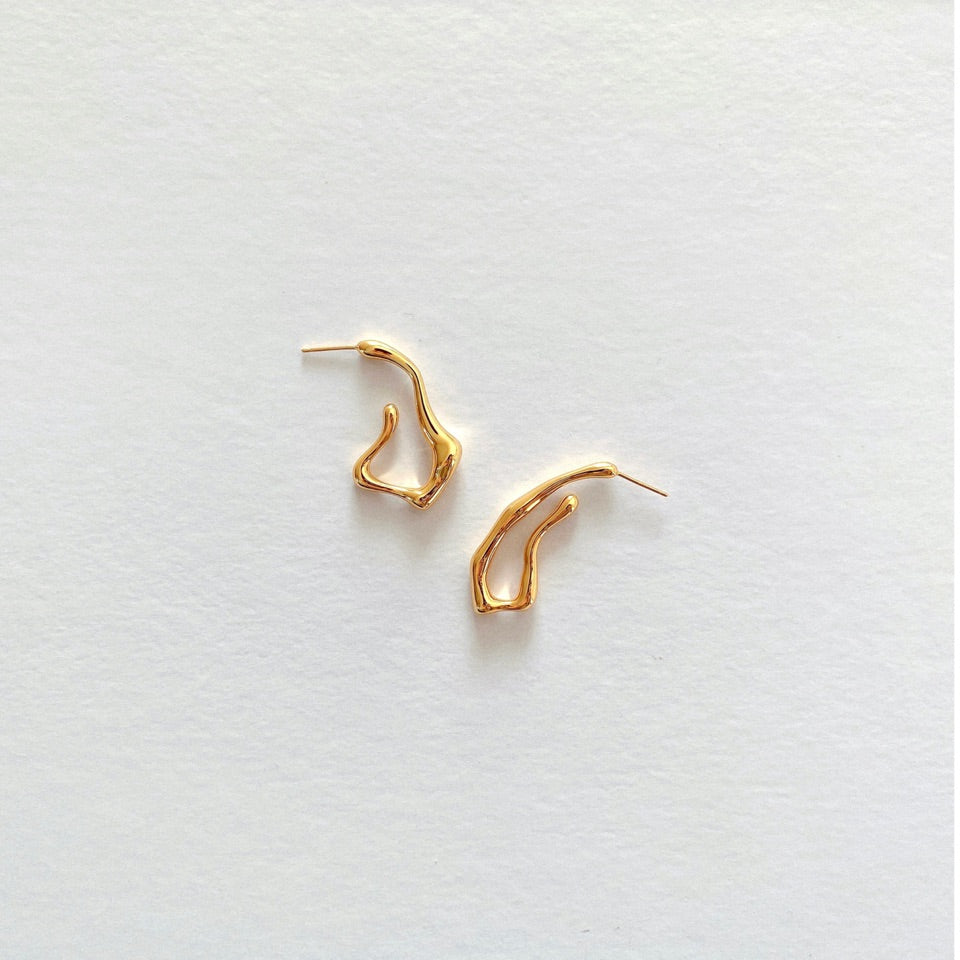 Squiggle-form earrings crafted in 18-karat gold vermeil silver, designed for a statement-making look that stands out.
