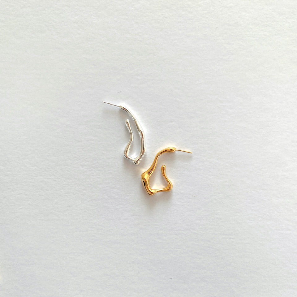 Squiggle-form earrings crafted in 18-karat gold vermeil silver, designed for a statement-making look that stands out.