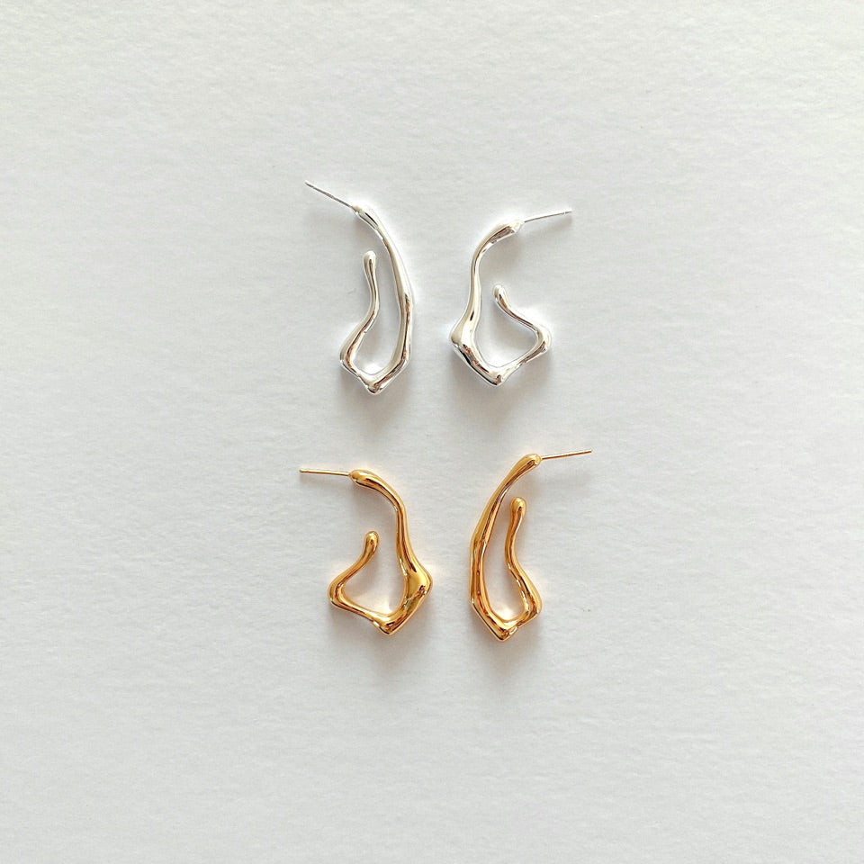 Squiggle-form earrings crafted in 18-karat gold vermeil silver, designed for a statement-making look that stands out.