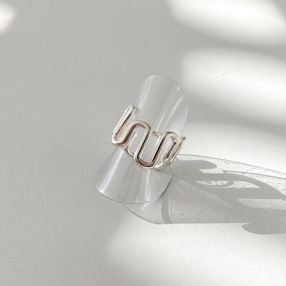 Crafted from sterling silver, this Wave Open Ring features an irregular yet chunky design that can be easily adjusted for the perfect fit.