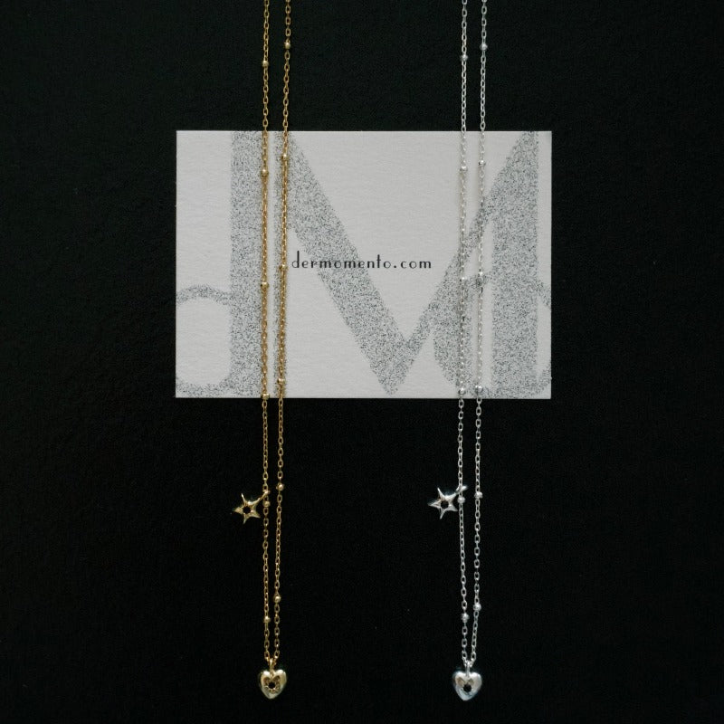 Starry Heart Necklaces featuring a heart and star design pendant, crafted from 18k gold vermeil sterling silver and adorned with sparkling small black zirconia stone.