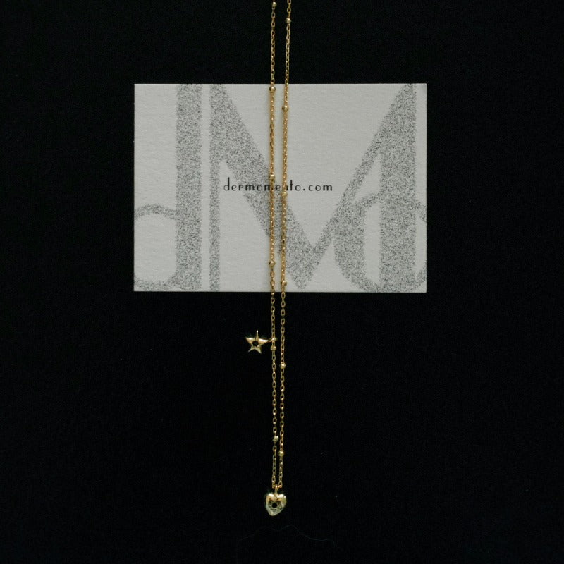Starry Heart Necklaces featuring a heart and star design pendant, crafted from 18k gold vermeil sterling silver and adorned with sparkling small black zirconia stone.