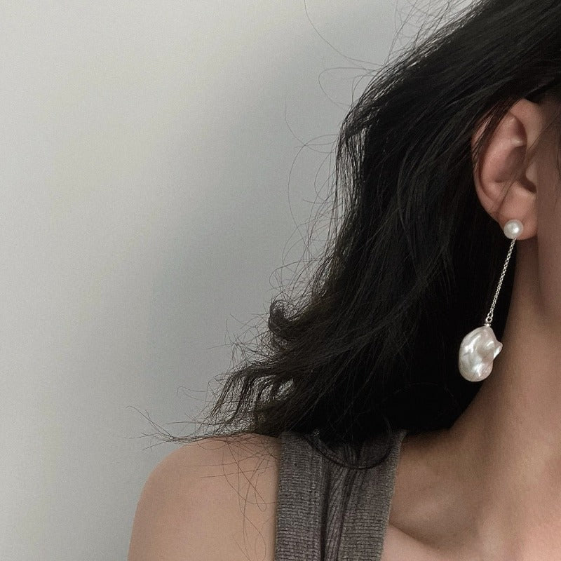 The Lovina Baroque Pearl Drop Earrings feature AB-style natural pearl studs paired with natural baroque pearl drops, allowing different wearing options - short, asymmetrical and long. Available in 14k gold-filled and sterling silver accents and can be customised in various styles (short-short, short-long, long-long).