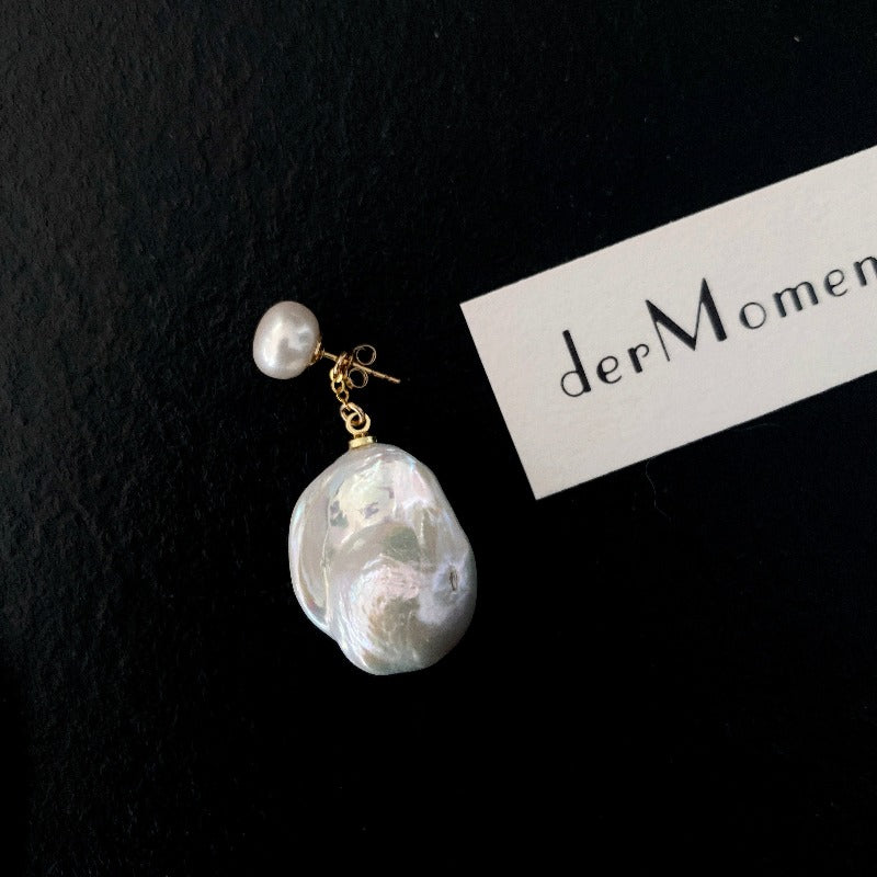 The Lovina Baroque Pearl Drop Earrings feature AB-style natural pearl studs paired with natural baroque pearl drops, allowing different wearing options - short, asymmetrical and long. Available in 14k gold-filled and sterling silver accents and can be customised in various styles (short-short, short-long, long-long).