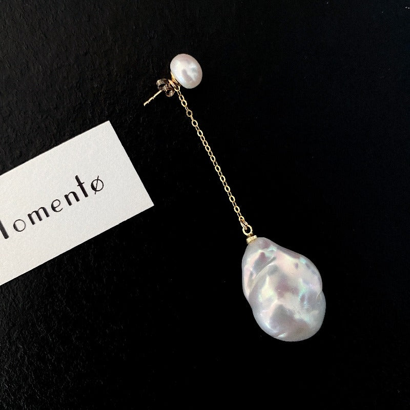 The Lovina Baroque Pearl Drop Earrings feature AB-style natural pearl studs paired with natural baroque pearl drops, allowing different wearing options - short, asymmetrical and long. Available in 14k gold-filled and sterling silver accents and can be customised in various styles (short-short, short-long, long-long).