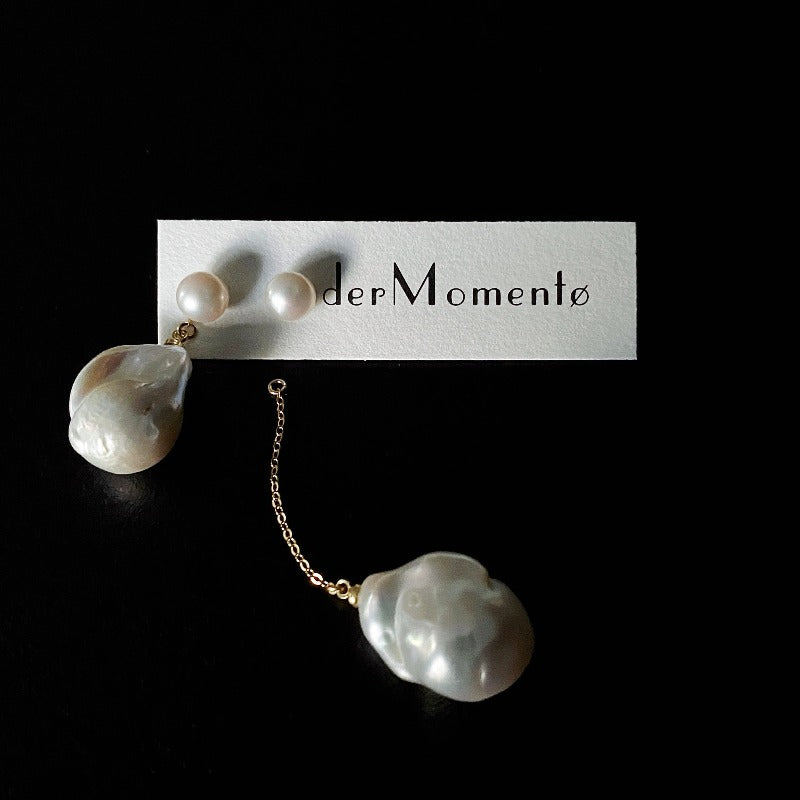 The Lovina Baroque Pearl Drop Earrings feature AB-style natural pearl studs paired with natural baroque pearl drops, allowing different wearing options - short, asymmetrical and long. Available in 14k gold-filled and sterling silver accents and can be customised in various styles (short-short, short-long, long-long).