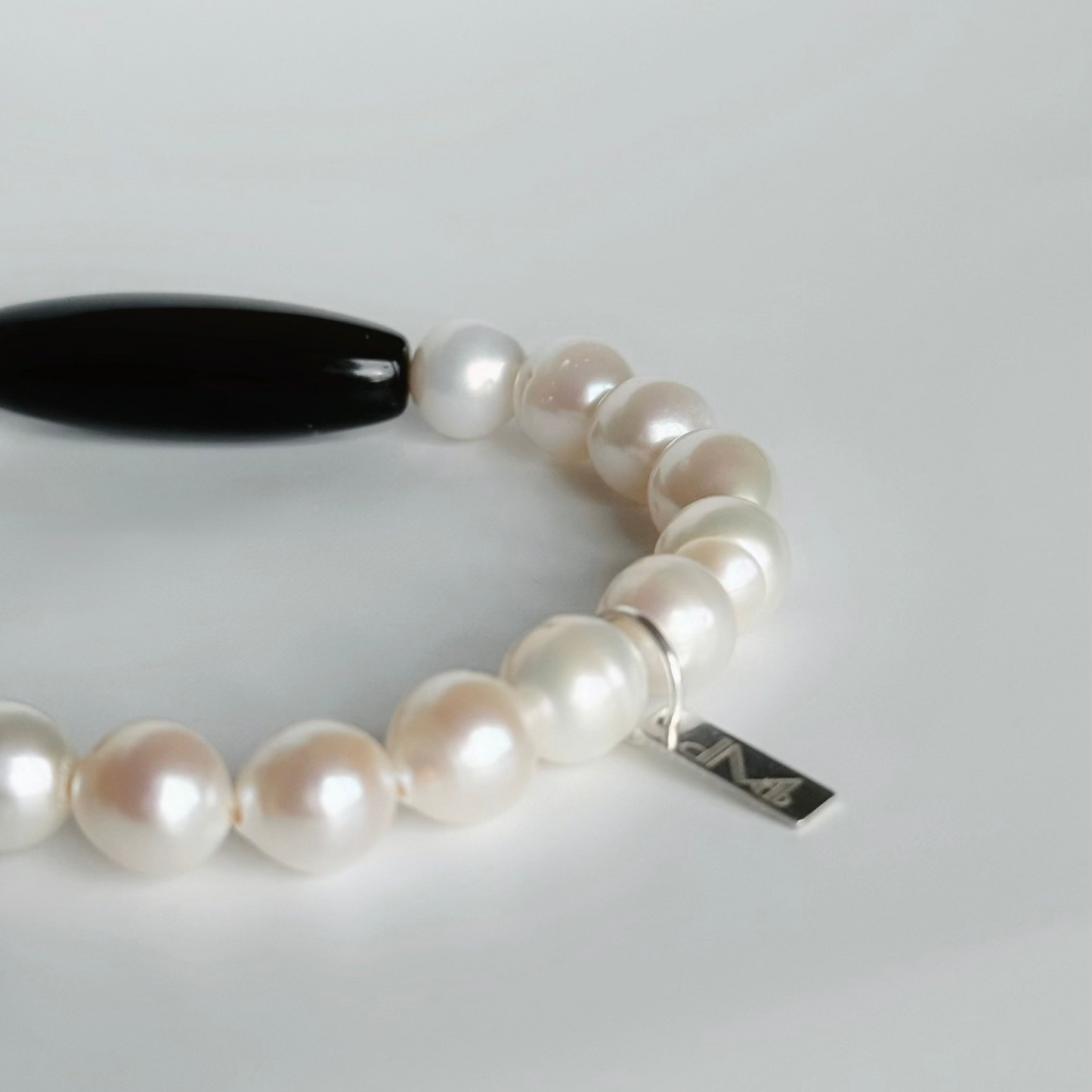 Naturally ridged white baroque freshwater pearls on NOVA bracelet
