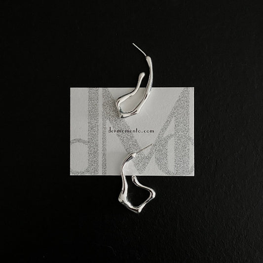 Squiggle-form earrings crafted in sterling silver, designed for a statement-making look that stands out.