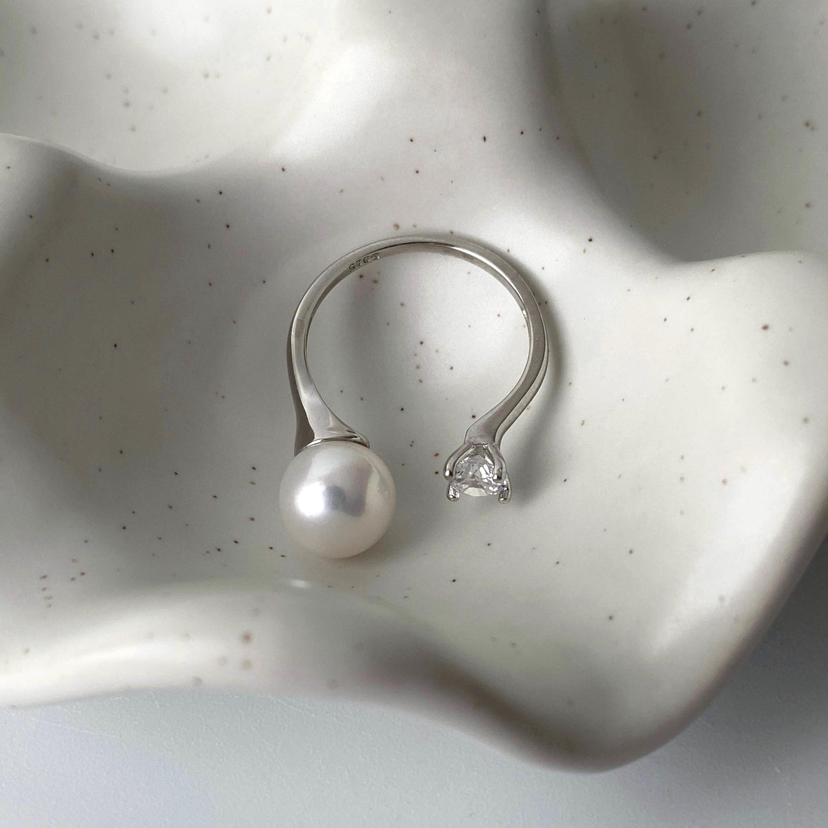 Adjustable sterling silver open band with freshwater pearl and zirconia