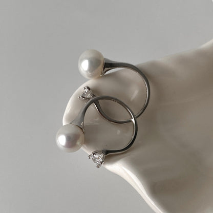Sterling silver pearl and zirconia open ring detail