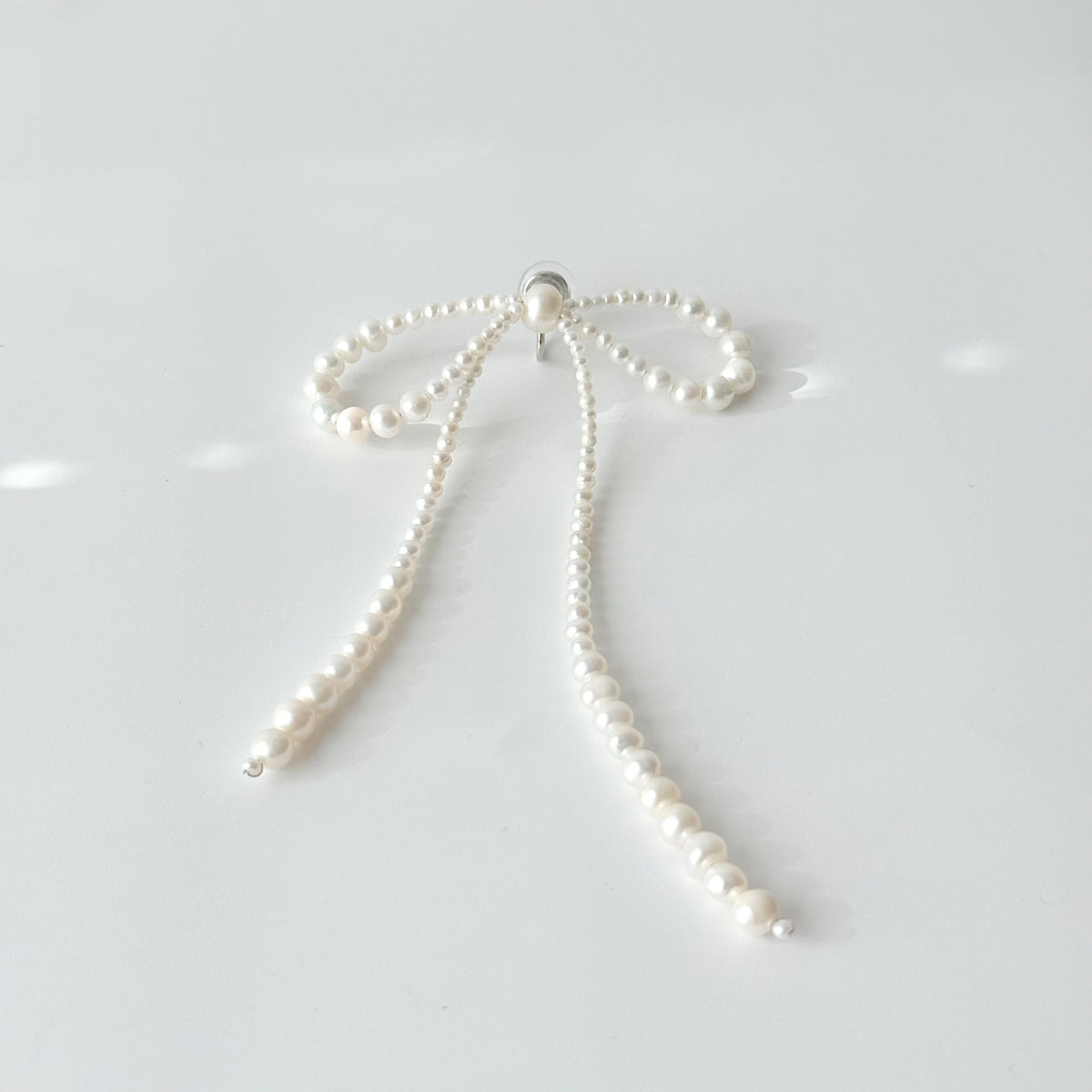 Handmade pearl bow clip-on earrings for non-pierced ears