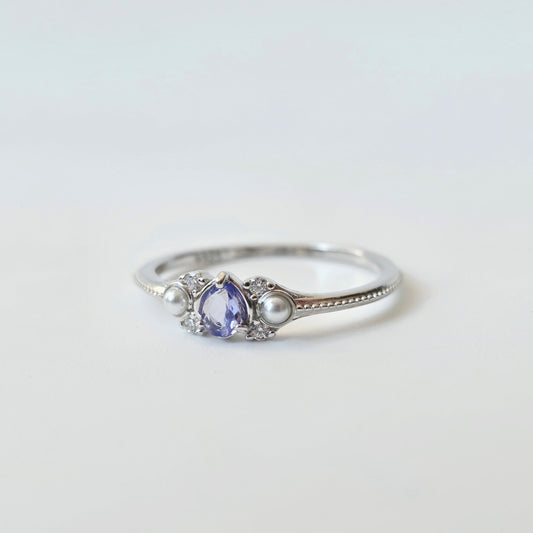 LINNIE tanzanite ring with pear-shaped purple gemstone and shell pearl accents