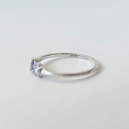 Side view of LINNIE tanzanite ring showing slim silver band and gemstone setting with S925 stamp