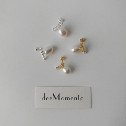 Pair of LYNN pearl stud earrings with oval pearls and angled zirconia rows