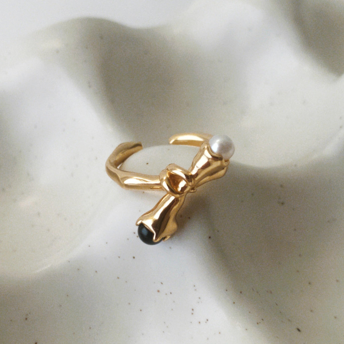 Gold vermeil open ring with black onyx and freshwater pearl
