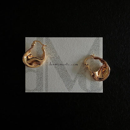 Sculptural gold vermeil hoop earrings with fluid, rounded curves