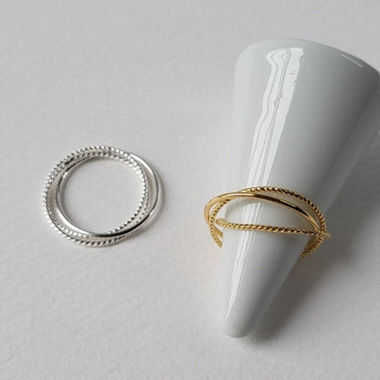 Composted of three different textured fine rings (3-in-1)  A perfect versatile piece crafted in 18-karat gold vermeil silver for wearing alone or stacking together.