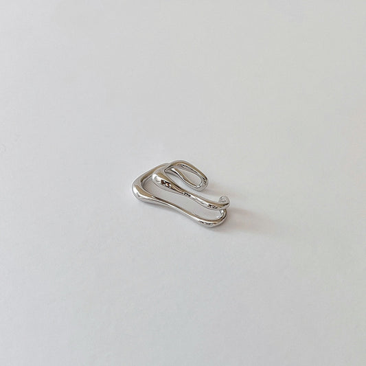 Claw-form ear cuff crafted in sterling silver with a white rhodium-plated finish.