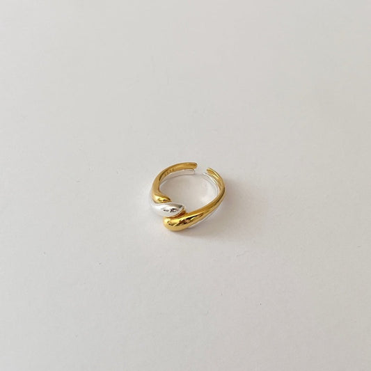 Unique double twist design ring set crafted in sterling silver and with an 18-karat gold vermeil finish.